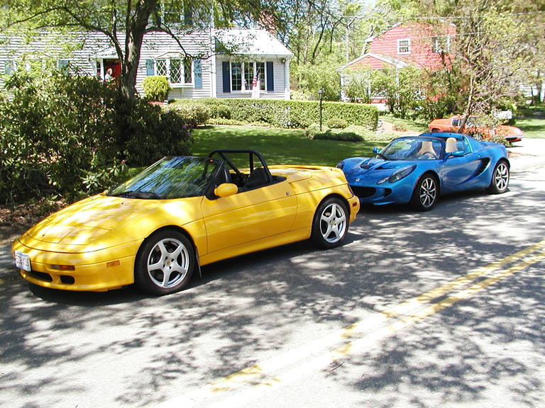 photo of Yellow M-100 Elan, Mark and Karen Michalski; Blue Elise, Dave Otten